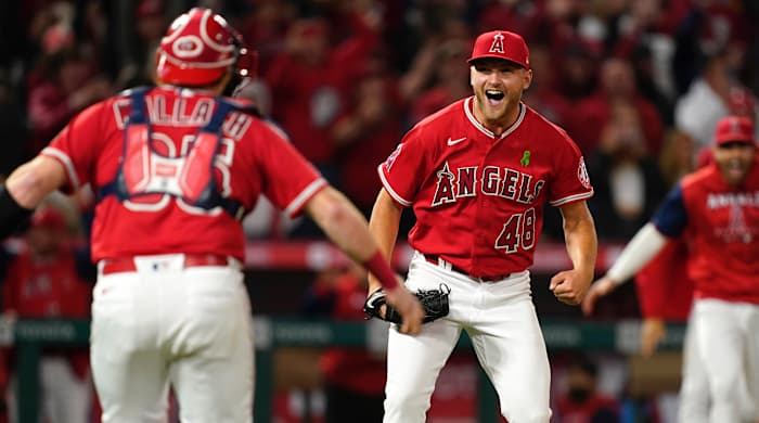 Los Angeles Angels starting pitcher Reid Detmers (48) celebrates with catcher Chad Wallach (35) after throwing a no hitter against the Tampa Bay Rays at Angel Stadium.
